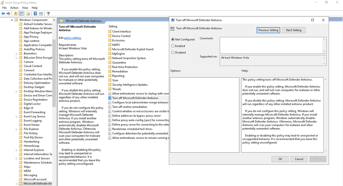 Dialog Turn off Microsoft Defender Antivirus di Local Group Policy Editor; pilih opsi Enabled lalu klik OK untuk mematikan Defender secara permanen